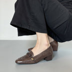 Clara loafer in brown, worn