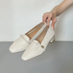 Clara loafers in cream, worn