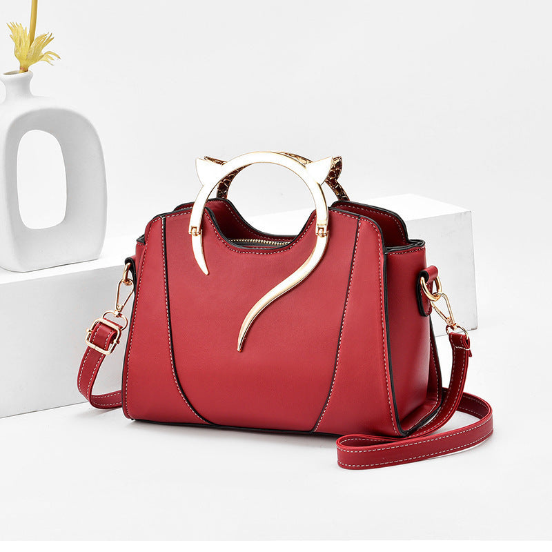 Sloane shell crossbody bag in burgundy