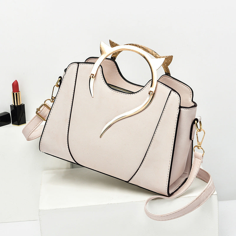 Sloane shell crossbody bag in cream
