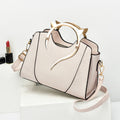 Sloane shell crossbody bag in cream
