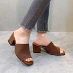 Freya block heel mules in brown, worn