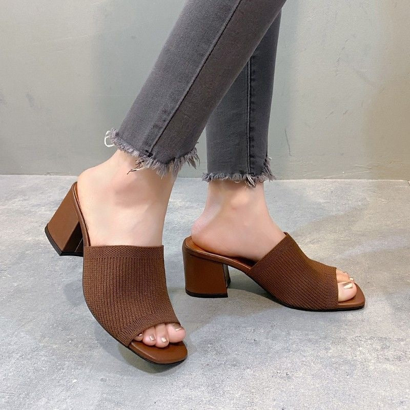 Freya block heel mules in brown, worn